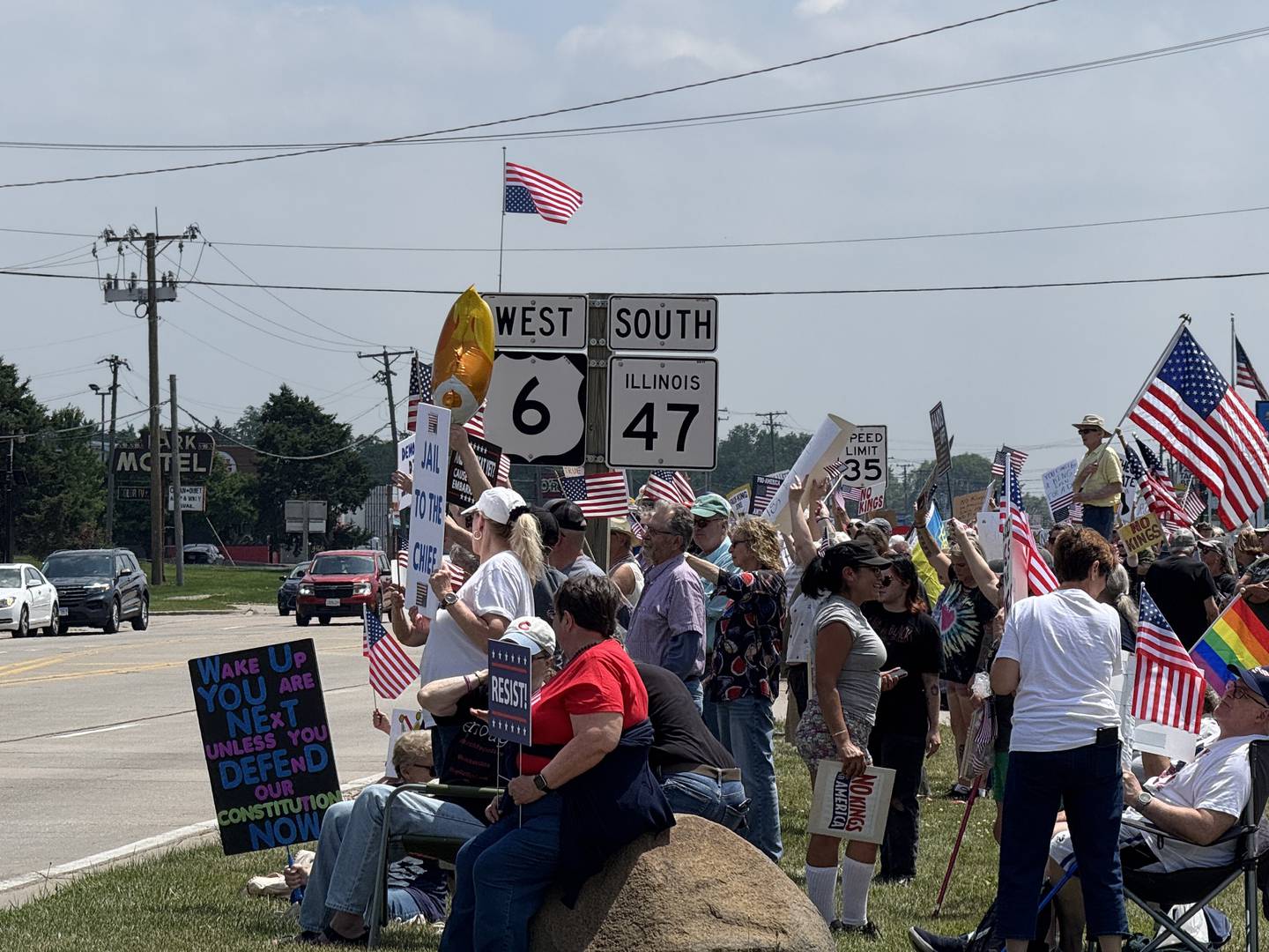 Protesters line up along the junction of US Route 6 and Illinois Route 47 for the No Kings Day protest in Morris on Saturday, June 14, 2025.