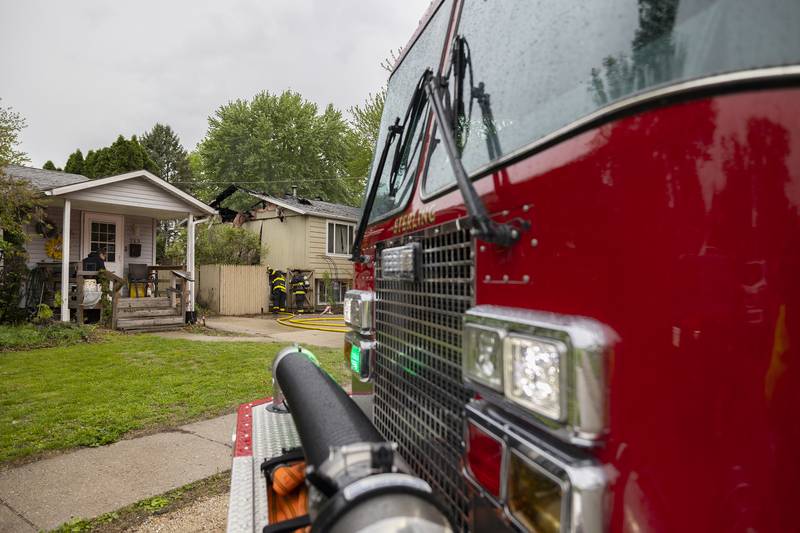 Firefighters work at the scene of a fire in the 800 block of Avenue I in Sterling on Monday, April 27, 2026.