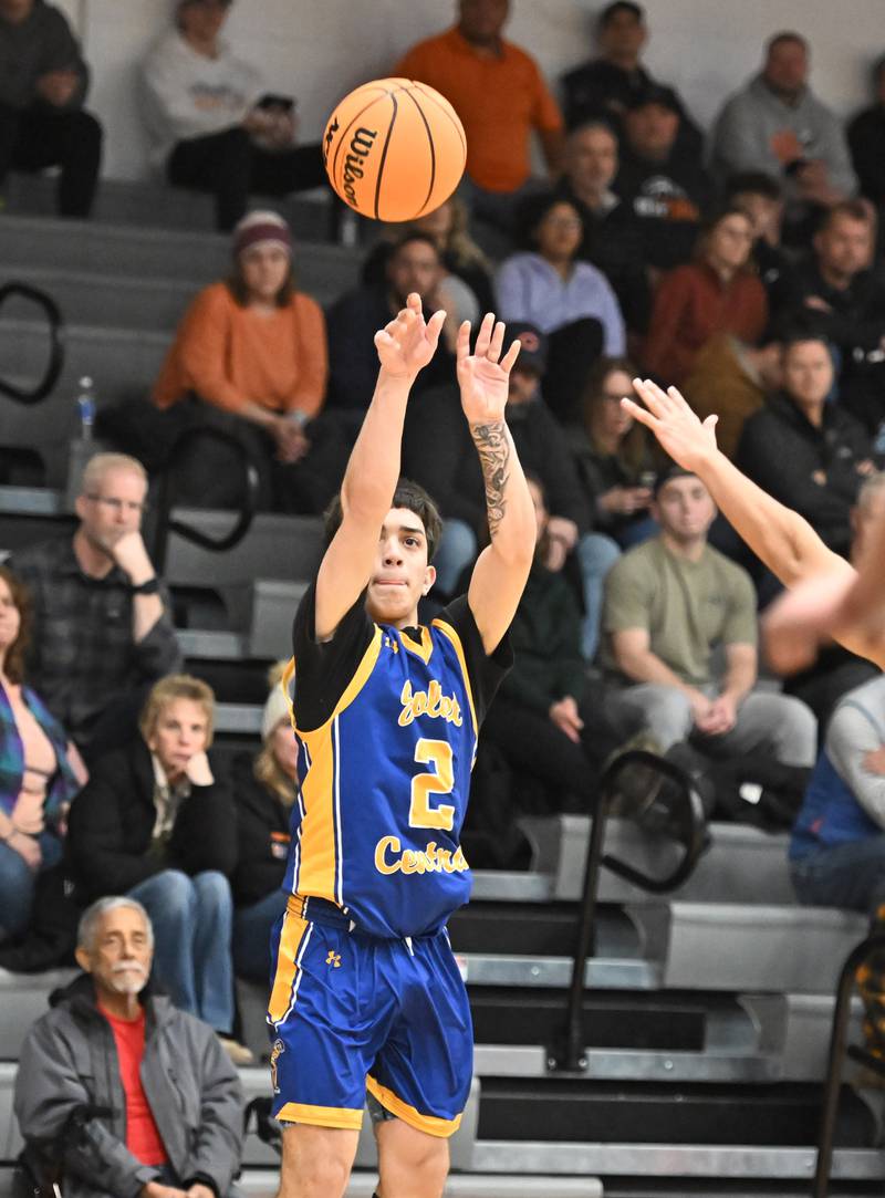 Joliet Central's Jayden Poplawski (2) shoots a 3 point shot during a conference game against Minooka on Friday, Jan. 10, 2025, at Minooka.