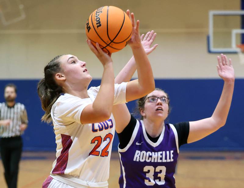 Genoa-Kingston's Regan Creadon shoots a layup in front of Rochelle's Riley Doyle during their game Monday, Dec. 16, 2024, at Genoa-Kingston High School.