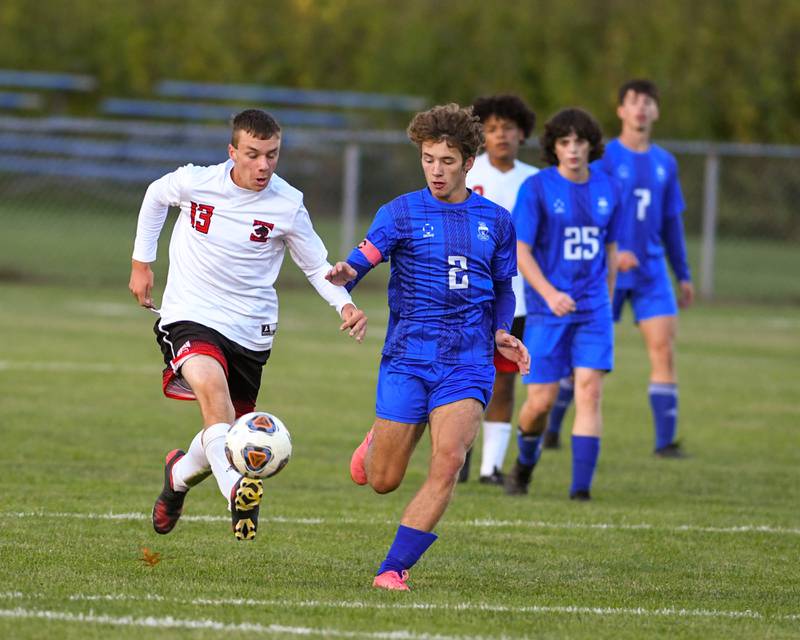 Indian Creek's Luas Odle kicks the ball away from Hinckley-Big Rock's Tyler Smith during the first half of the game during Monday Sept. 26th game at Hinckley-Big Rock High School.