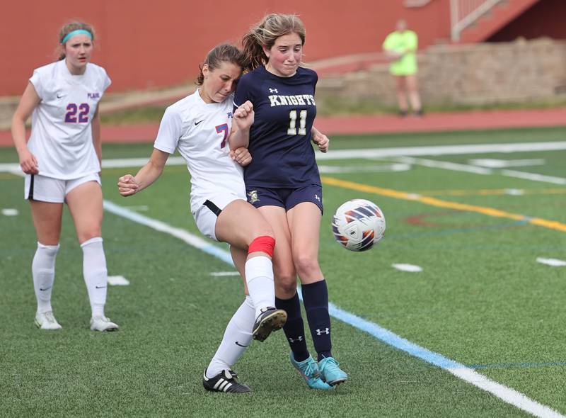 Pleasant Plains' Adi Fraase (left) and IC Catholic Prep's Alysa Lawton collide going after the ball during their IHSA Class 1A state girls soccer third place game Saturday, May 27, 2023, at North Central College in Naperville.