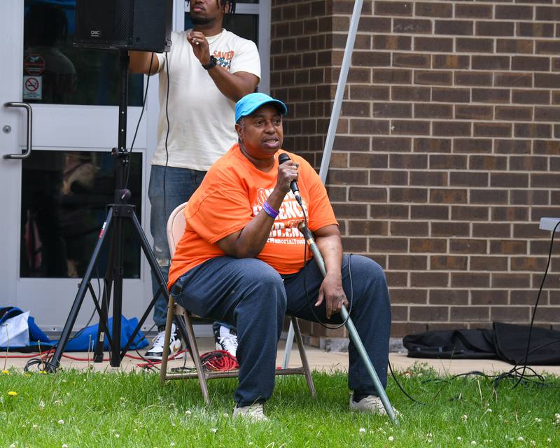 Family friend Sharon Grant talks on Saturday, June 7, 2025, during the Ezra Hill Jr. Memorial Foundation’s 5th annual rock painting event held at Tyler Elementary School in DeKalb. The foundation was created to memorialize the late DeKalb boy, shot and killed in 2019.