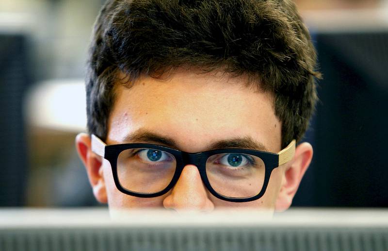Woodstock High School senior Danny Robles concentrates while he works on his web design class project on Wednesday, Feb. 25, 2014. The number of high school students enrolled in one of three High School Plus programs at McHenry County College was up 31.3 percent last year compared to the year before, much of the growth over the last five years has occurred within the college's College in High School program. Woodstock High School's web design class was the latest to be added to the line up. The district currently offers nine dual-credit courses.