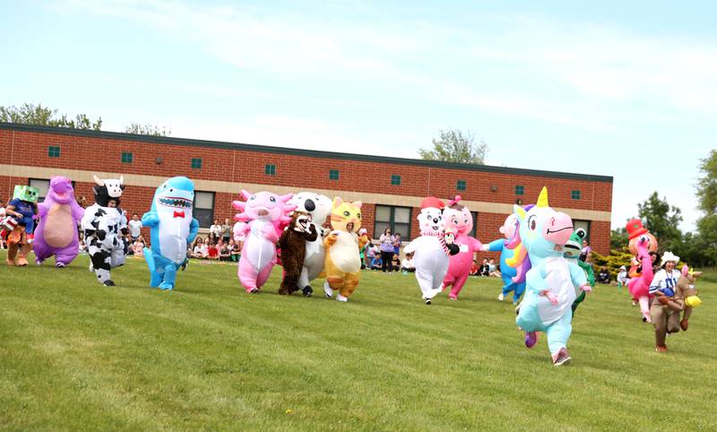 Teachers and staff members surprised students at Emily G Johns Elementary School in Plano with an inflatables race on Tuesday, May 27. 2025 after the all-school field day to celebrate the end of the school year.