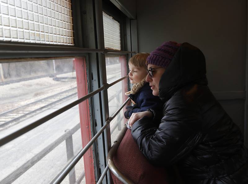 Sarah Green and her son, Jacob, 4, looks out the window as they ride a North Shore train Saturday, Jan. 21, 2023, as the Illinois Railway Museum celebrates its 70 anniversary with the first of many celebrations by commemorating the 60 years since the abandonment of the Chicago North Shore and Milwaukee Railroad.