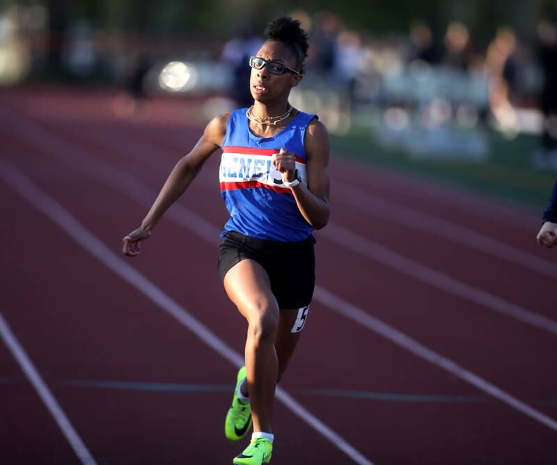 Geneva’s Alyssa Flotte wins the 100-meter dash during the 2024 Kane County Girls Track and Field meet at St. Charles East on Thursday, April 25, 2024.