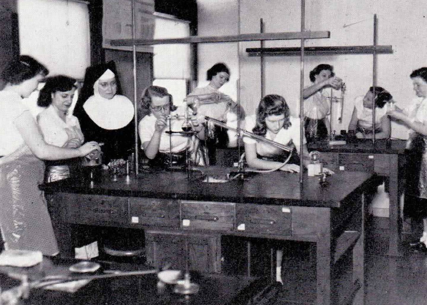 In 1950, students and their instructor are busy in a science lab. This year marks the 125th anniversary of Nazareth Academy in La Grange Park, founded in 1900.