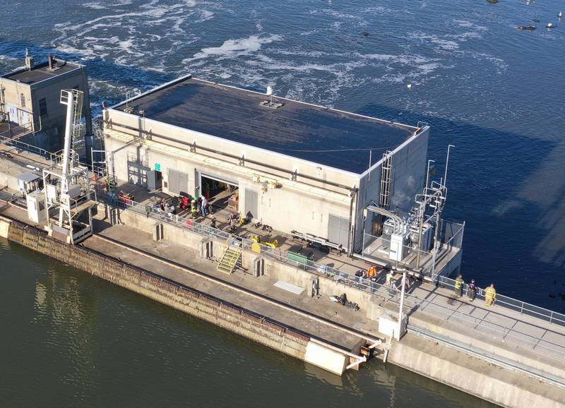 Fire crews work the scene of a fire at the Starved Rock hydroelectric power plant at the Starved Rock Lock and Dam on Tuesday, Oct. 3, 2023 near Utica. A MABAS box alarm was sent out just before 730a.m. for a working fire inside the plant.