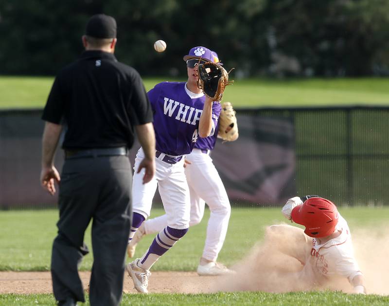 Hampshire's Cole Harkin fields the throw as Huntley's Jack Ezell steals second base during a Fox Valley Conference baseball game on Monday, April 28, 2025, at Huntley High School.
