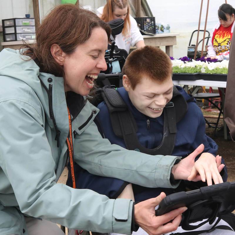 Jessica Marcellis-Montavon, DeKalb School District 428 Transition Program teacher and vocational coordinator, along with student Kaden Seidelberg have a laugh as they work together Thursday, May 9, 2024, at Walnut Grove Vocational Farm in Kirkland. The Transition Program is dedicated to serving students with intellectual and developmental disabilities ages 18 to 22.