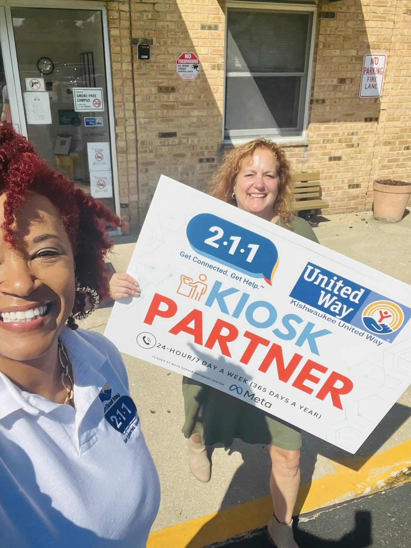 (Left) Michele Vaughn, executive director of Kishwaukee United Way, poses with Jennifer Yochem of the city of DeKalb, who serves as the United Way's Board of Directors chair, alongside a self-help kiosk.