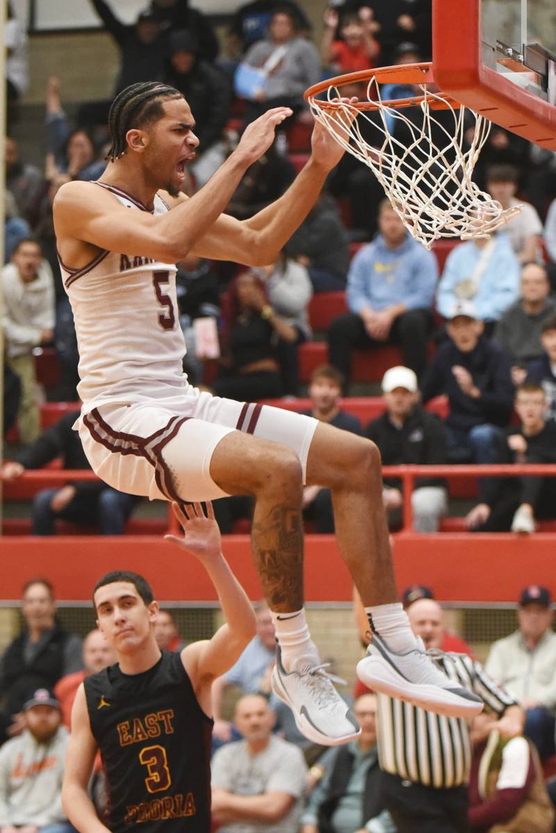 Kankakee's EJ Hazelett releases from the rim after throwing down a dunk during the IHSA Class 3A Ottawa Sectional semifinals against East Peoria Wednesday, March 4, 2026.