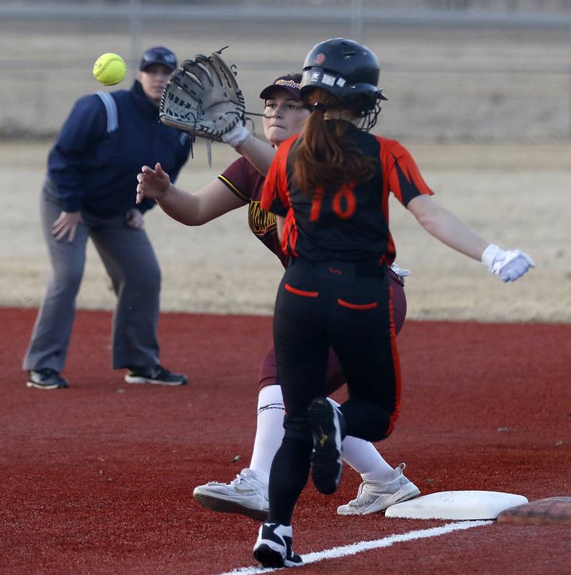 Richmond-Burton's Norah Spittler forces out Crystal Lake Central's Makayla Malone as she runs to first base during a nonconference softball game Wednesday March 16, 2022, between Crystal Lake Central and Richmond-Burton at Lippold Park in Crystal Lake.