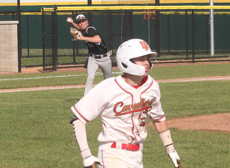 Kaneland's Preston Popovich throws out L-P's Jett Hill running to first base on Tuesday, May 13, 2025 at Huby Sarver Field at the L-P Athletic Complex in La Salle.