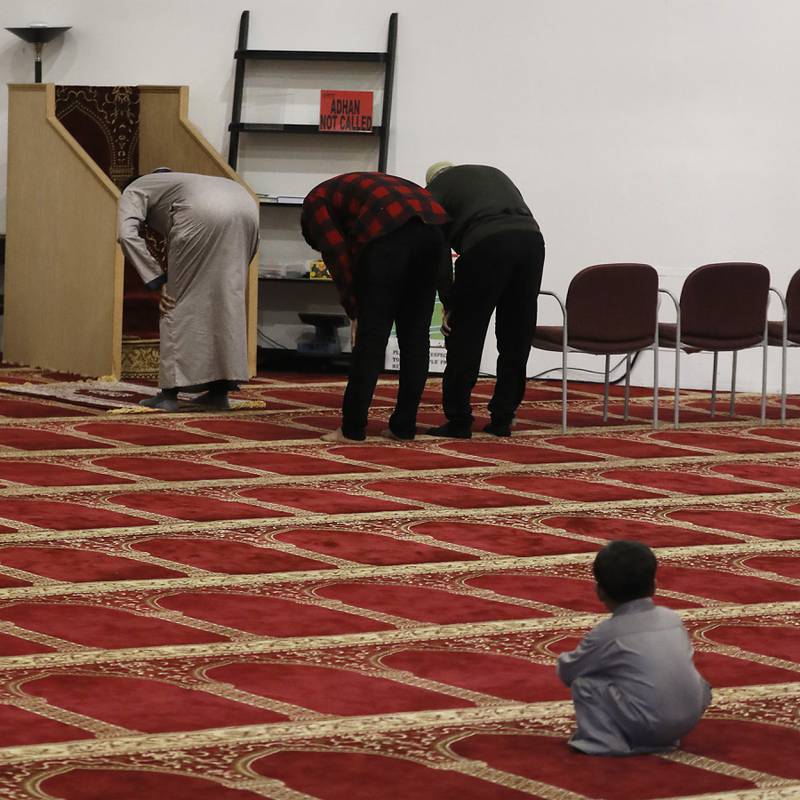 Members of the American Muslim Community Organization mosque pray Tuesday, Oct. 17, 2023, at the organization's mosque in Lake in the Hills.