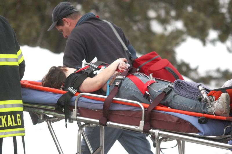 Shaw Local 2008 file photo – An unidentified victim of a shooting rampage at Cole Hall on the DeKalb campus of Northern Illinois University is transported to a waiting ambulance by