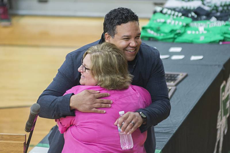 Franks Harts hugs Kelly Schaefer, RFHS thespian troupe 3439 advisor, during a special recognition for the actor during the school’s awards and honors assembly Thursday, May 5, 2022. The school has started a thespian Hall of Fame with Harts being the first inductee.