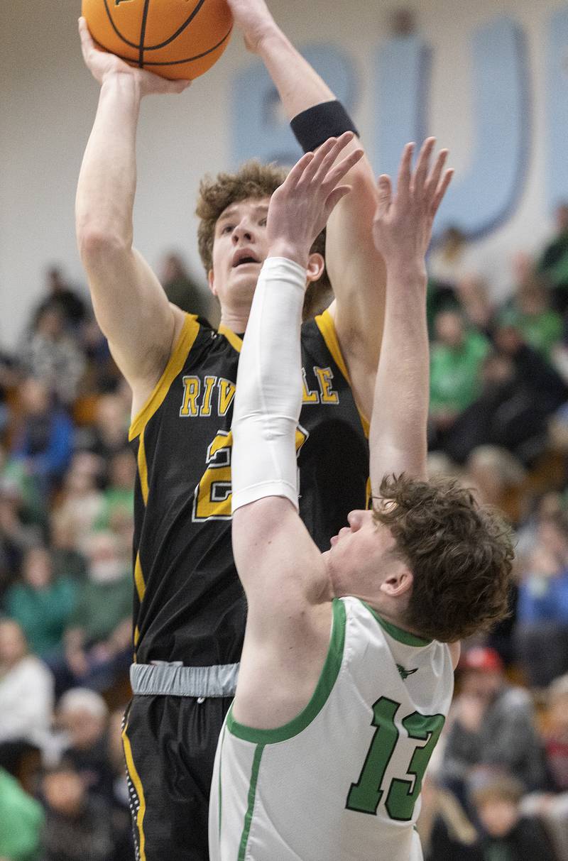 Riverdale’s Jacob Watson puts up a shot  against Rock Falls’ Ryken Howard Friday, Feb. 28, 2025, during the Class 2A Regional final at Bureau Valley High School.