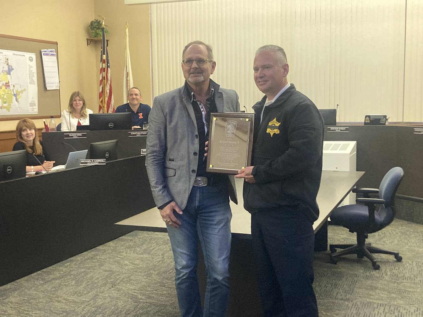 Lockport Mayor Steven Streit presents outgoing Police Chief Rich Harang with a plaque at the City Council meeting on Wednesday, June 18, 2025.