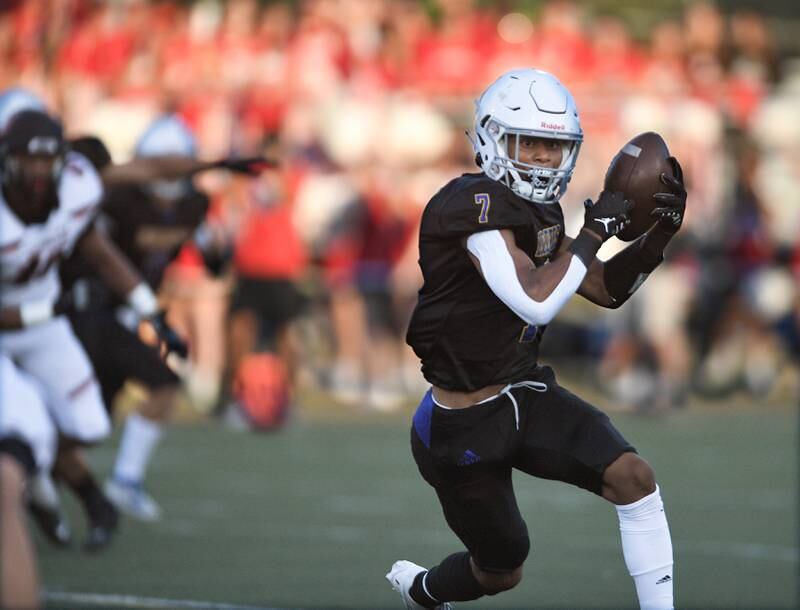 Warren’s Cassius Callahan catches a pass for a big gain against Barrington in a football game in Gurnee on Friday, August 26, 2022.