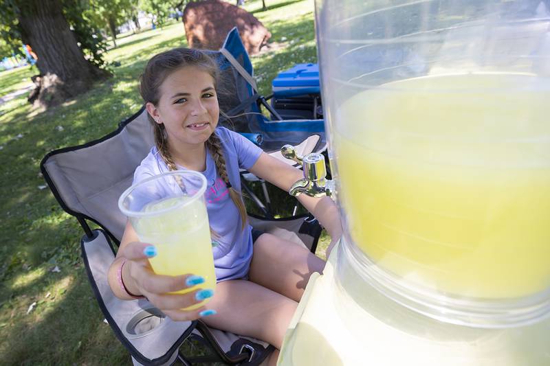 Vida Rubio, 11, was selling lemonade, SunnyD and chips to help fund her trip Monday, June 23, 2025, at her stand in Dixon.