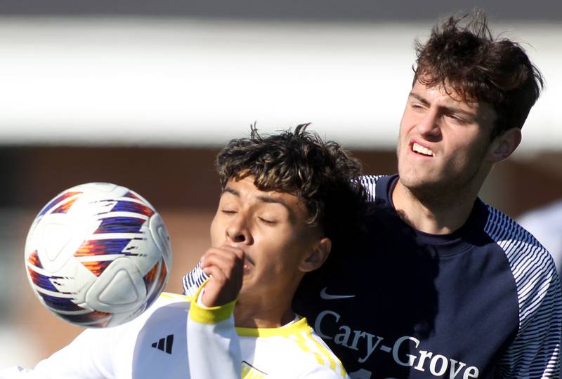 Cary-Grove’s Finlay Evangelista, right, and Harvard’s Jesus Aquino battle for the ball in IHSA Class 2A Regional Title Game soccer action on Saturday, Oct. 26, 2024, at  Harvard Junior High School  in Harvard.