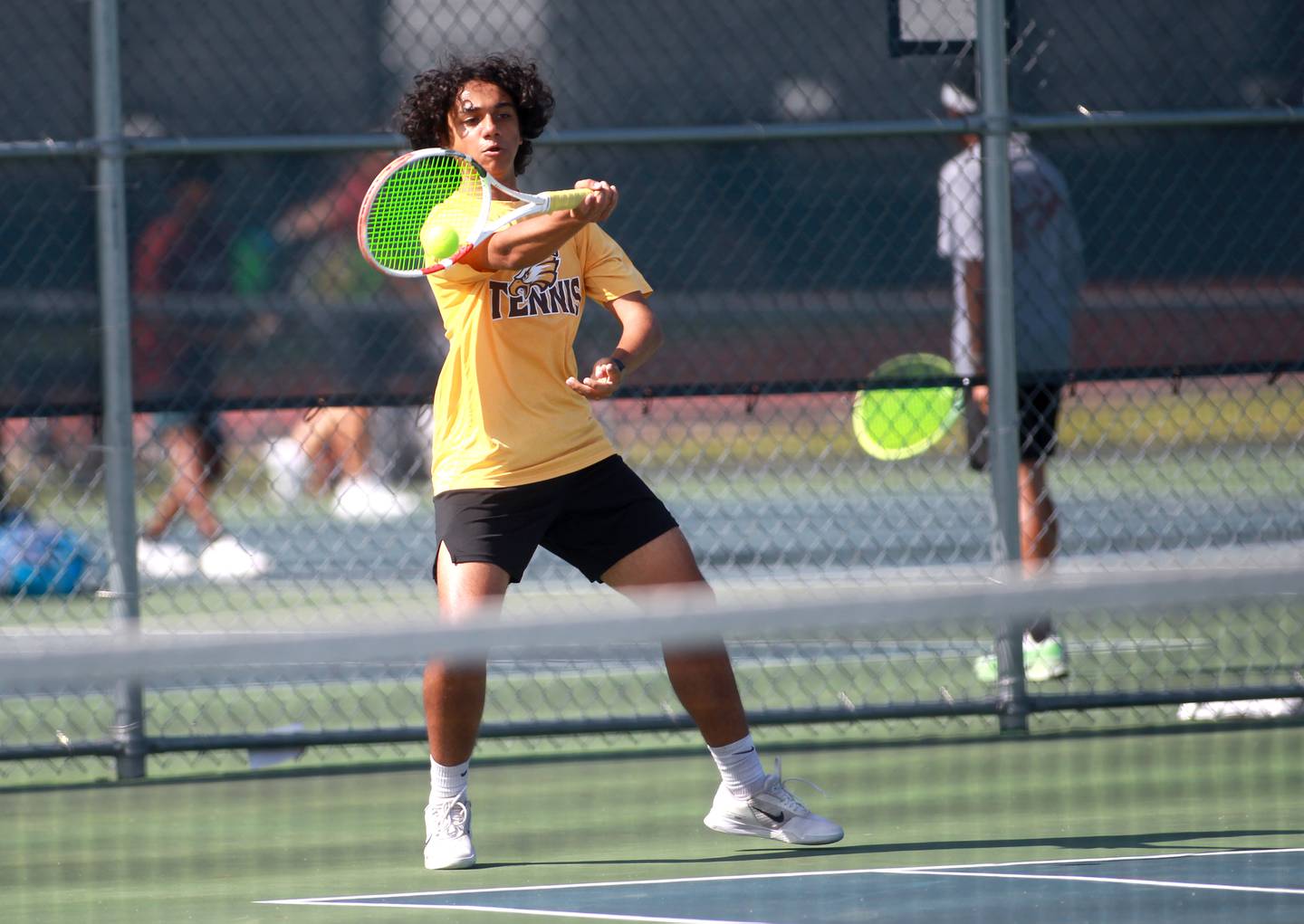 Jacobs’ Soham Kalbra returns the ball during a doubles match with partner Augie Nelson (not pictured) in the state championship preliminaries at Buffalo Grove High School on Thursday, May 23, 2024.