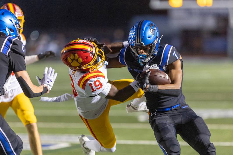 Batavia's Saimarr Howell goes for the tackle on St. Charles North's EJ Mondesir on Friday, Sept. 26, 2025 in St. Charles.