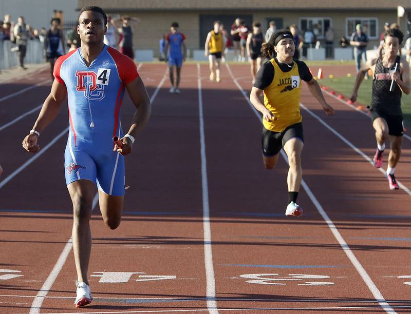 Dundee-Crown's Oreoluwa Sobodu crosses the finish line as he runs the last leg of the 4x100 meter relay during the Fox Valley Conference  Boys Track and Field Meet on Thursday, May 14, 2026, at Huntley High School.
