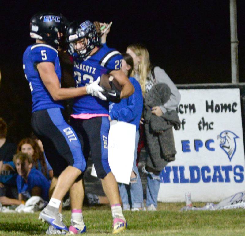 Eastland-Pearl City's Draven Zier (22) celebrates with Parker Simons (5) after scoring a touchdown during a Friday, Oct. 3, 2025 game at Pearl City Hich School.