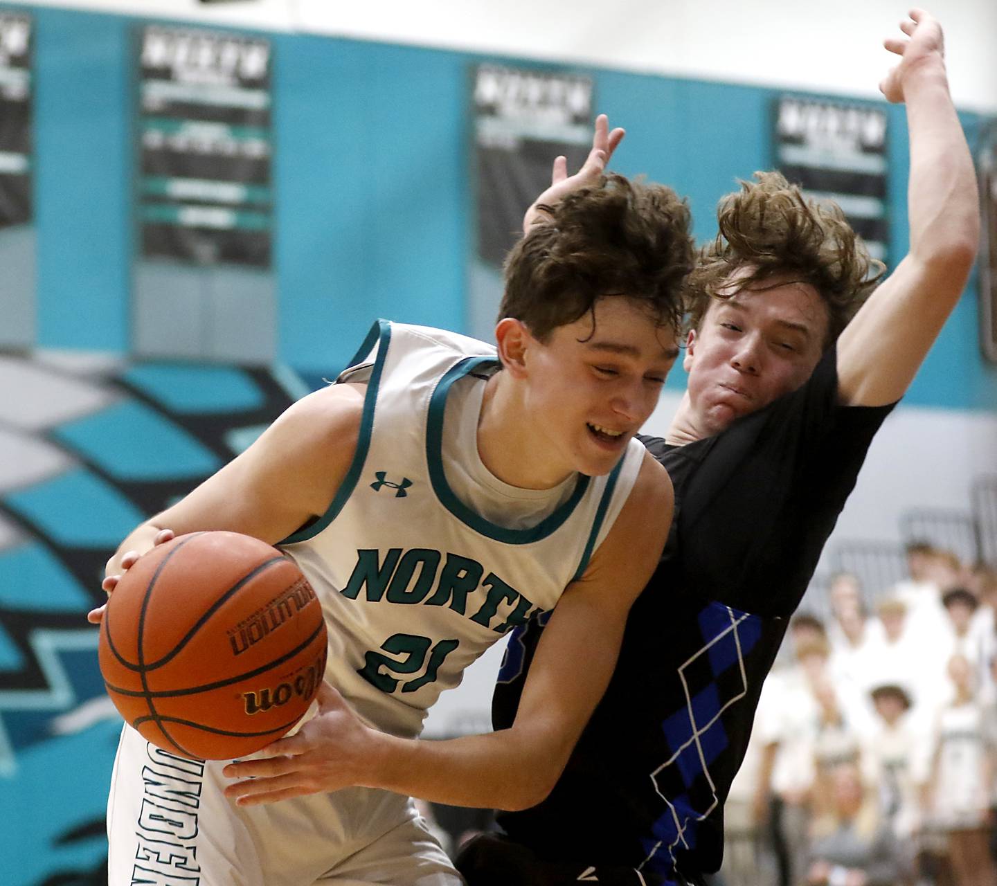 Woodstock North's Cade Blaksley drives to the basket against Woodstock's Samuel Chapman during a Kishwaukee River Conference boys basketball game on Friday, Jan. 5. 2024, at Woodstock North High School.