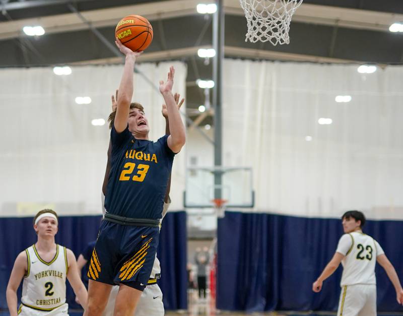 Neuqua Valley's Cole Kelly (23) shoots the ball in the post against Yorkville Christian during a basketball game at Yorkville Christian High School on Tuesday, February 4, 2025.