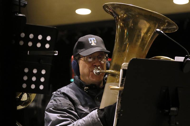 Brian Allen plays the tuba during the Lighting of the Square Friday, Nov. 24, 2023, in Woodstock. The annual holiday season event featured brass music, caroling, free doughnuts and cider, food trucks, festive selfie stations and shopping.