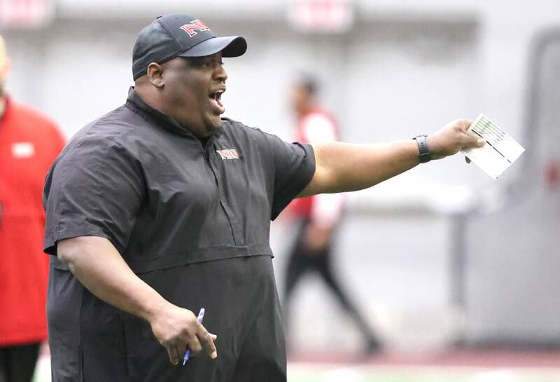 Northern Illinois head coach Thomas Hammock  calls out some instructions during the teams first spring practice Wednesday, March 22, 2023, in the Chessick Practice Center at Northern Illinois University in DeKalb.