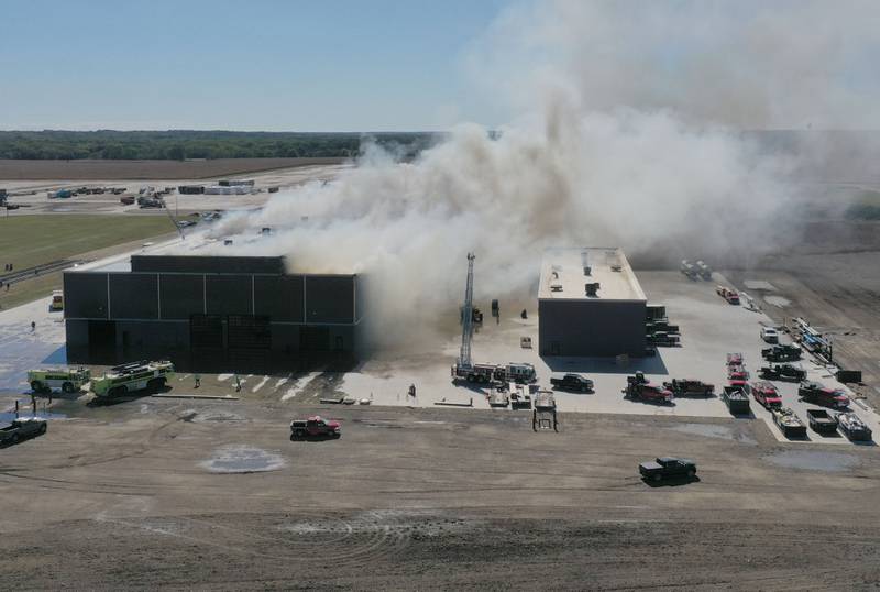 Smoke billows from Marquis Energy as firefighters work to control a structure fire on Wednesday, Oct. 8, 2025 in Hennepin. The fire was upgraded to a 5th alarm dispatching the (MABAS) Mutual Aid Box Alarm System. The fire broke out around 11a.m.
