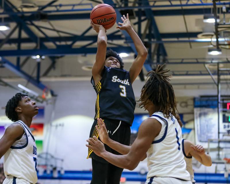 Hinsdale South's Adam Flowers (3) puts up a shot after an offensive rebound during basketball game between Hinsdale South at Downers Grove South. Dec 1, 2023.