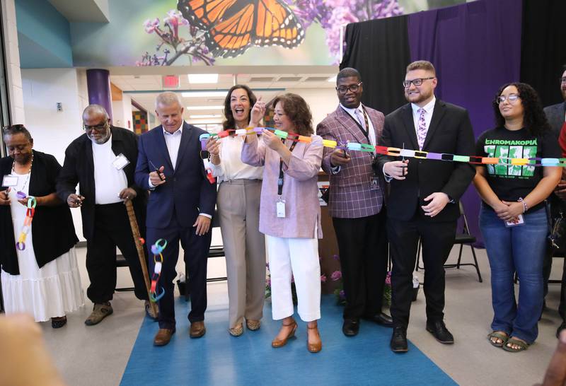 DeKalb city officials, representatives from DeKalb School District 428 and honorees cut the ribbon Friday, Aug. 8, 2025, during the grand opening celebration for Mitchell Elementary School in DeKalb.