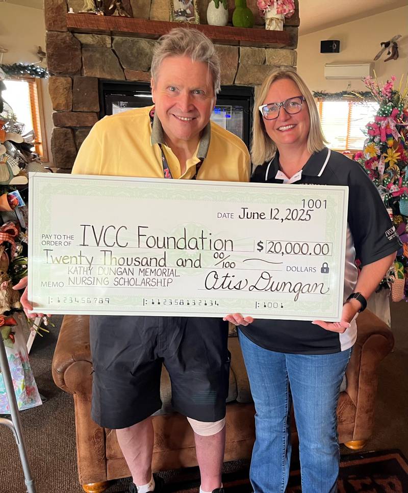 Otis Dungan presents IVCC President Dr. Tracy Morris with a check to establish a nursing scholarship in memory of his wife, Kathy. Kathy Dungan, a native of Mendota, credited IVCC with launching her successful 30-year career in healthcare