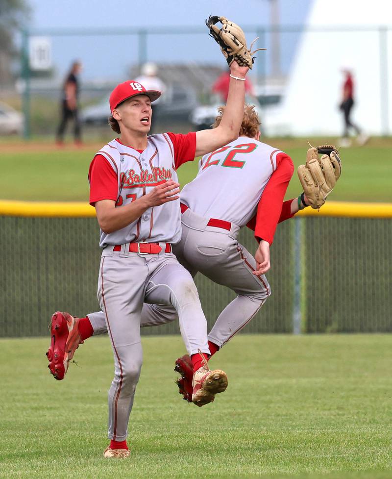 LaSalle-Peru's Grey Ernat makes a catch as teammate Ceyton Urbanski avoids the collision Tuesday, May 12, 2026, during their game at Kaneland High School in Maple Park.