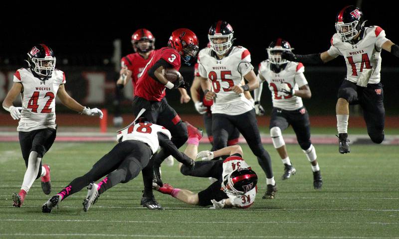 Huntley’s Omare Segarra runs the ball against Niles West  in first-round Class 8A playoff football action at Huntley Friday.