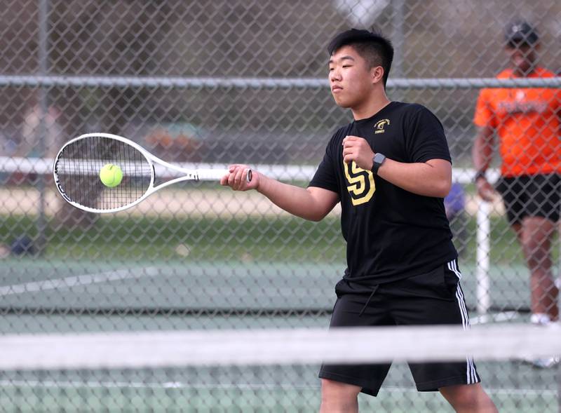 Sycamore number one singles player Regan Ni hits a forehand Thursday, April 24, 2025, during their match against DeKalb at Sycamore High School.