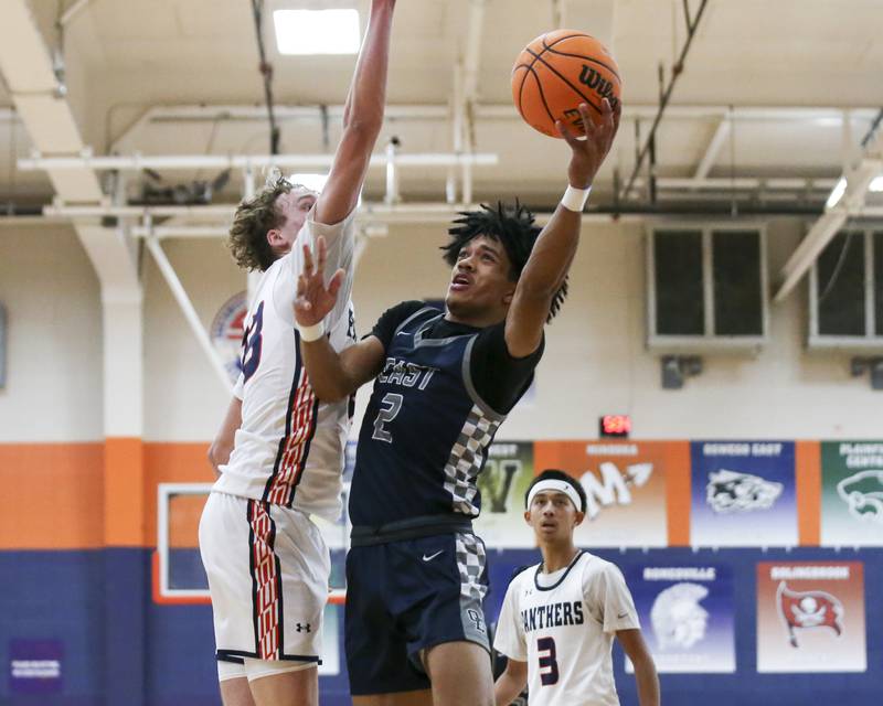 Oswego East's Jacsen Tucker (2) puts up a shot off of a drive to the basket during their basketball game between Oswego East at Oswego Friday, Jan 09, 2025 in Oswego.