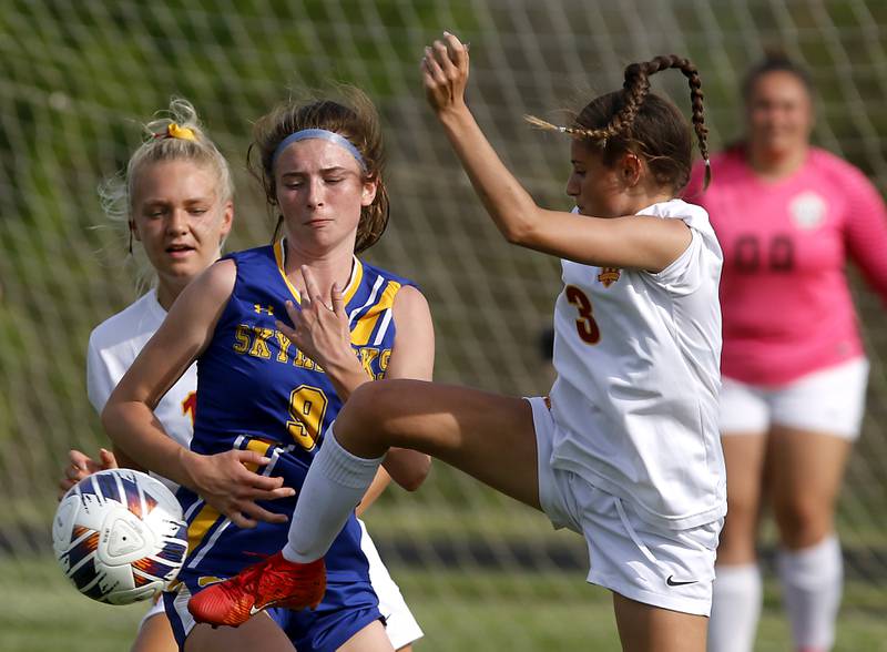 Richmond-Burton's Mckenzie Ragusca (right) kicks the ball away from Johnsburg's Kaylee Fouke during the IHSA Class 1A Marian Central Sectional Championship match on Tuesday, May 21, 2024, at Marian Central High School.