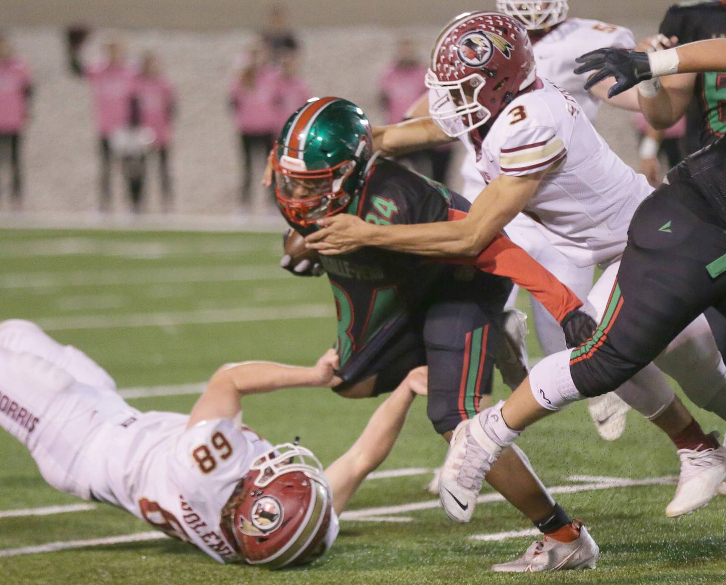 L-P's Tre'von Hunter (no,34) is brought down by Morris's Sam Reddinger (no,3) on Friday Oct. 15, 2021.