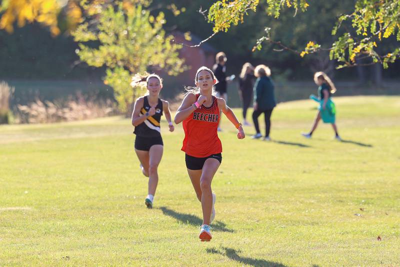 Beecher's Rachel Imig finishes in fourth just ahead of Herscher's Sophie Venckauskas in the girls 3-mile race during All-Area Cross Country meet on Wednesday, Oct. 8, 2025, at Kankakee Community College.