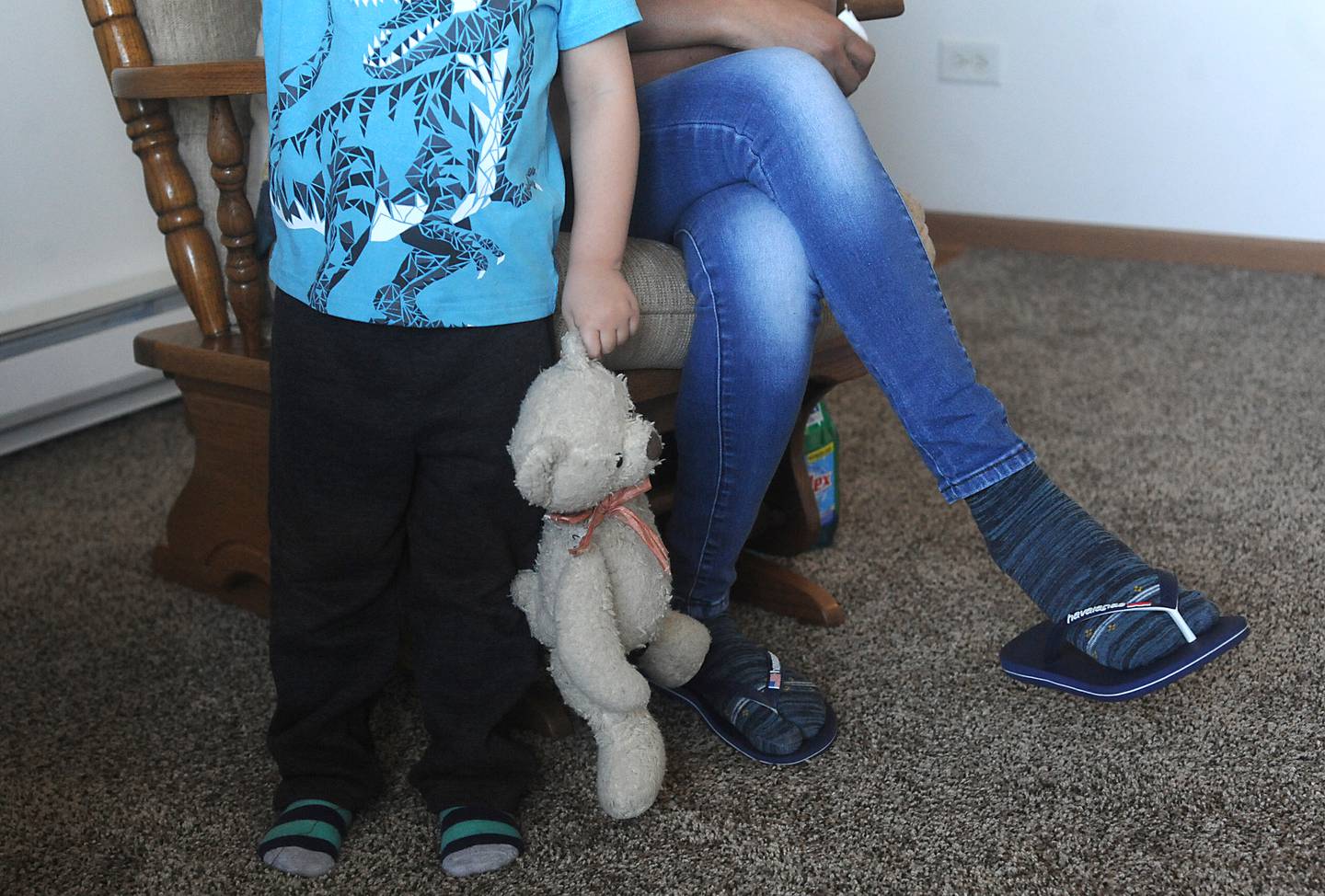 Wilma Alex's son holds a teddy bear as his mom talks about all the help she received after being nearly killed in early March, during an interview Thursday, April 21, 2022, in her apartment in McHenry County. Her husband, Mark Alex, was charged with attempted first-degree murder.