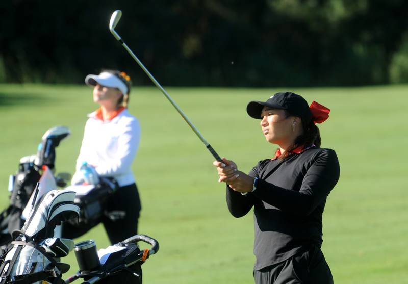 Yorkville's Mia Natividad hits an iron shot onto the 10th green during the Southwest Suburban Conference girls golf meet at Whitetail Ridge Golf Club on Thursday, Sept. 22, 2022.