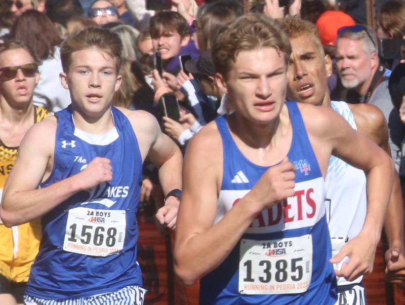 Lake Villa Lakes Payton Whitehead and Marmion Academy's Matthew Sullivan competes in the Class 2A State Cross Country race on Saturday, Nov. 4, 2023 at Detweiller Park in Peoria.