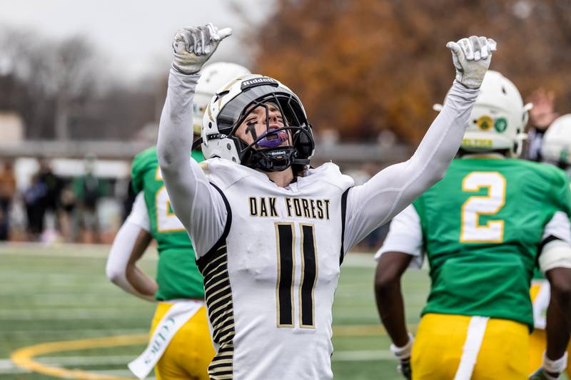 Oak Forest's Kevin Sullivan celebrates after blocking a pass during a 5A varsity football semifinal game against Providence at Providence Catholic High School on Nov. 22, 2025.